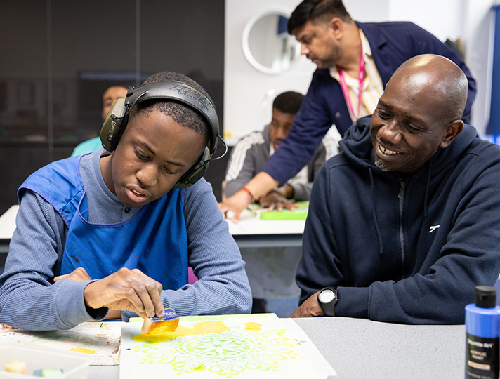 Teacher teaching a student skills